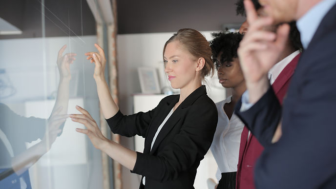 successful-female-team-leader-formal-outfit-presenting-new-project-multiethnic-partners.jp